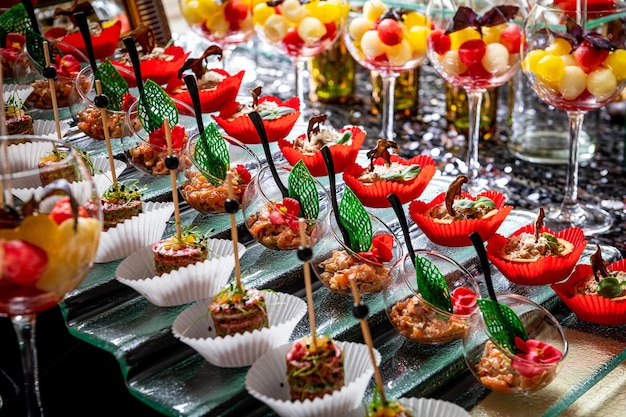 Various snacks buffet table with different dishes Serving food in a restaurant at a party