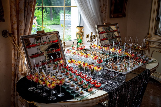 Various snacks buffet table with different dishes