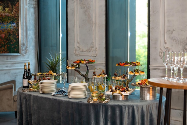 various snacks on stands on the buffet table selfservice at the event