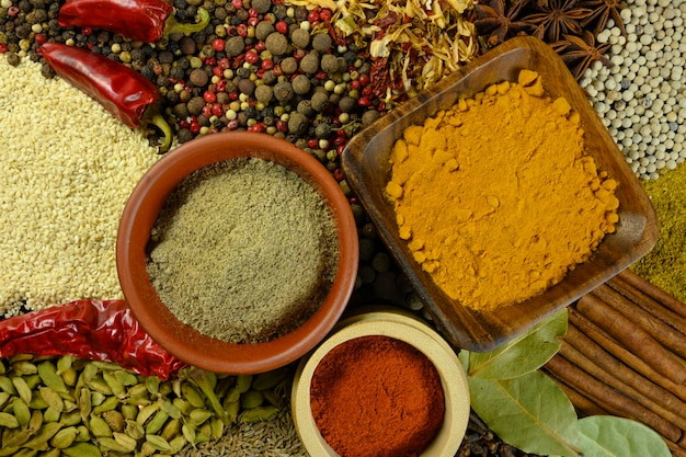 Various spices are scattered on the table