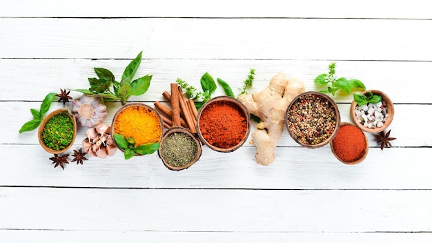 Various spices in a bowls on white background Indian spices Top view