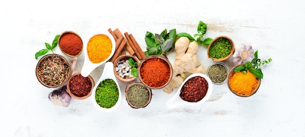 Various spices in a bowls on white background Indian spices Top view