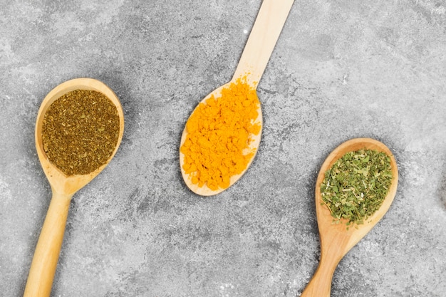 Various spices on a gray background. Top view. Food background