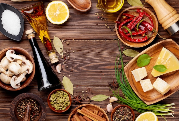 Various spices on wooden background