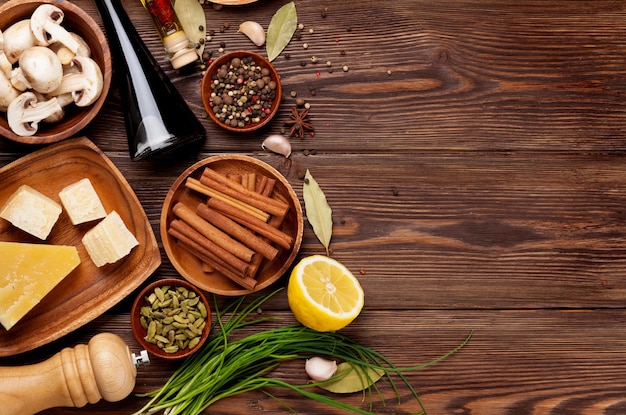 Various spices on wooden background