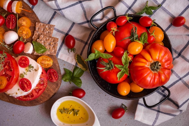 Various tomatoes with mozzarella and basil