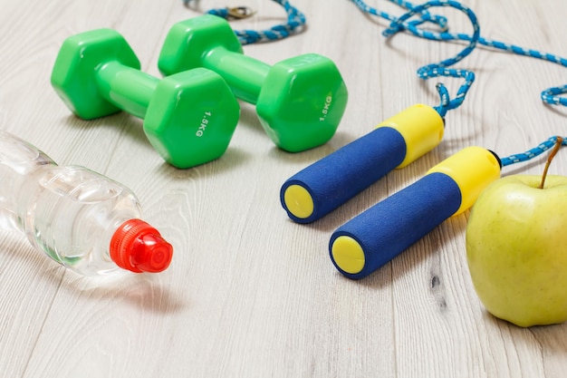 Various tools for fitness on floor in room