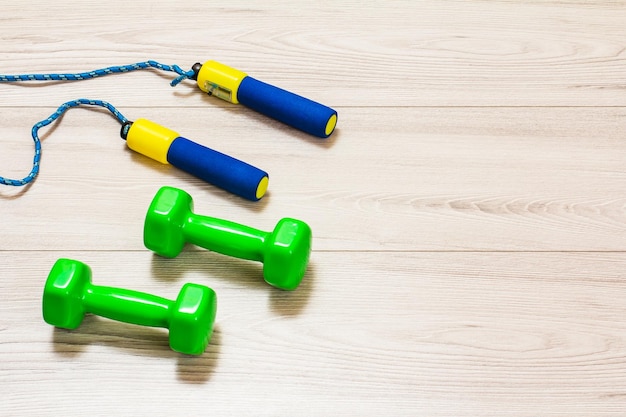 Various tools for fitness on floor in room