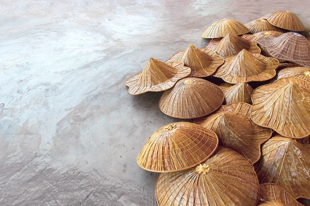 Various types of asian conical hats in tourists' souvenir markets in Thailand