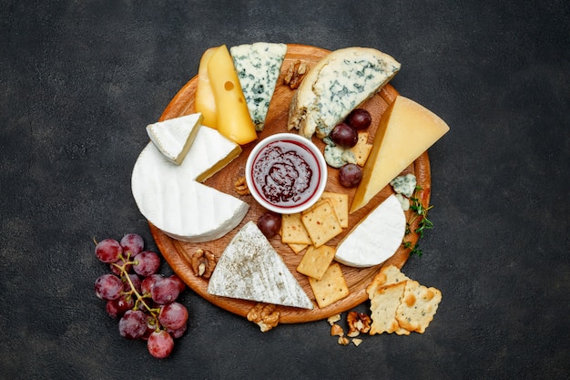 Various types of cheese - parmesan, brie, roquefort, cheddar