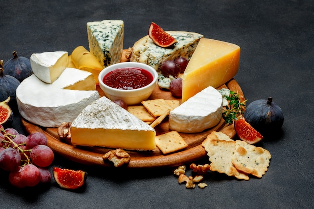 Various types of cheese - parmesan, brie, roquefort, cheddar