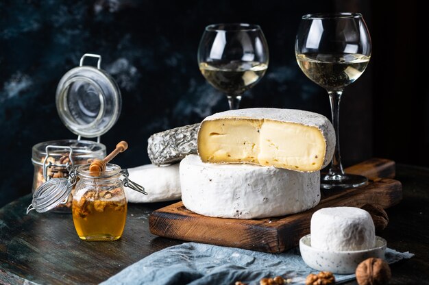 Various types of cheese on table