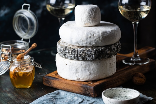 Various types of cheese on table