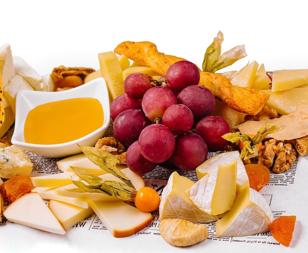 various types of cheese with fruits