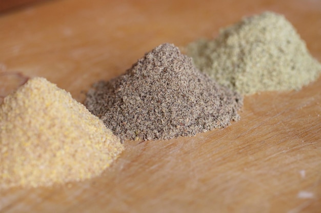 Various types of flour on wooden brown table