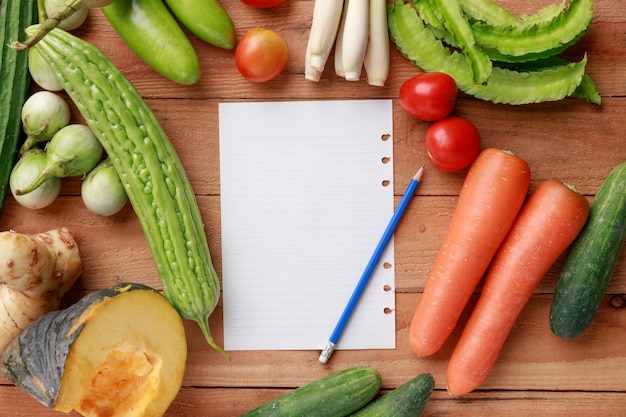 Various vegetables, spices and ingredients with a sheet of paper