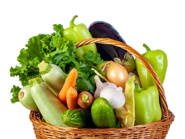 Various vegetables in a wicker basket isolate on white, fresh food