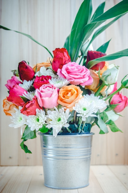 Vase of bouquet Roses in aluminium bucket