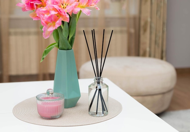 Vase of flowers aroma reed diffuser and candle