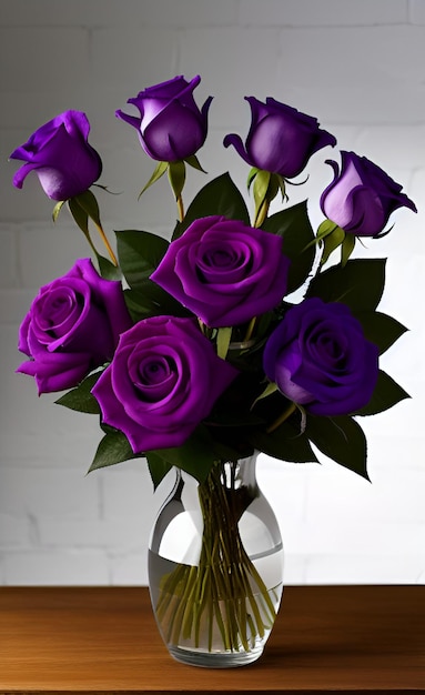 A vase of purple roses with green leaves is on a table.