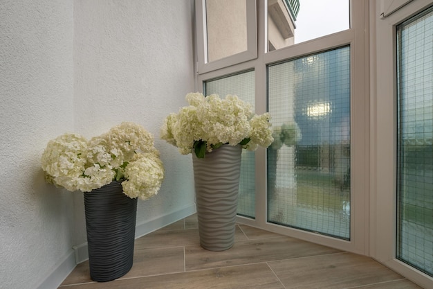 Vase with a bouquet of flowers in the interior