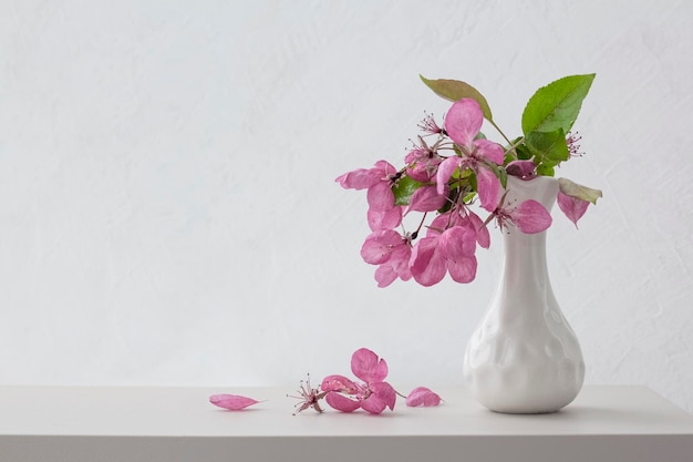 Vase with flowers light background Copy space