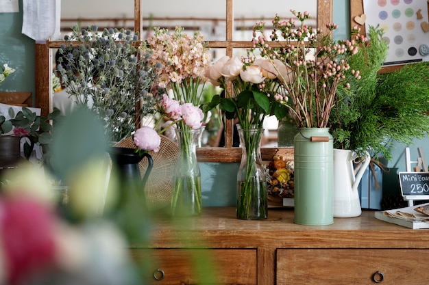 Vases of colorful exotic flowers on a sale counter