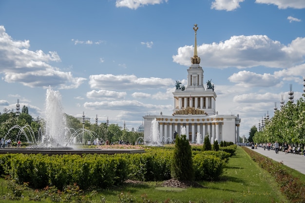 VDNH The central pavilion on the background of fountains and flowers Russia Moscow