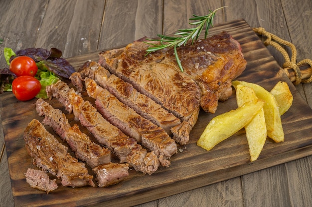 veal chop with potatoes and vegetables