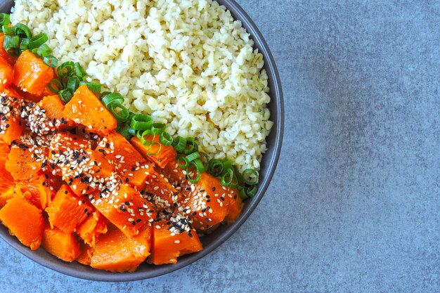 Vegan bowl with bulgur and pumpkin. Healthy tasty food. The concept of proper nutrition.