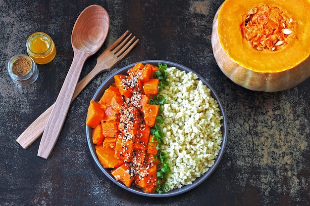 Vegan bowl with bulgur and pumpkin. Healthy vegan food in a bowl.