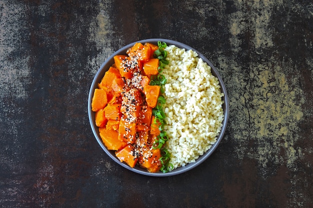 Vegan bowl with bulgur and pumpkin. Healthy vegan food in a bowl.