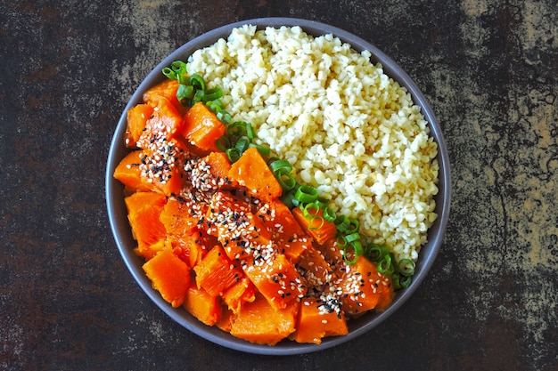 Vegan bowl with bulgur and pumpkin. Healthy vegan food in a bowl.