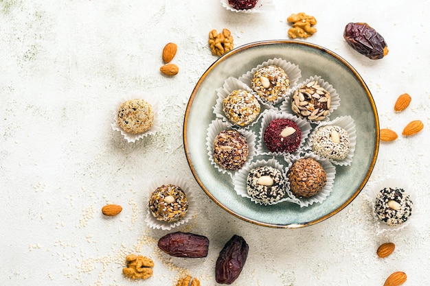 Vegan candies made from nuts and dried fruits energy ball copy space