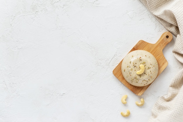 Vegan cashew cheese on a wooden board