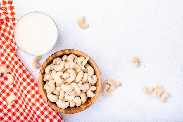 Vegan Cashew nut milk on white background Non dairy alternative vegan milk Healthy vegetarian food and drink Copy space top view