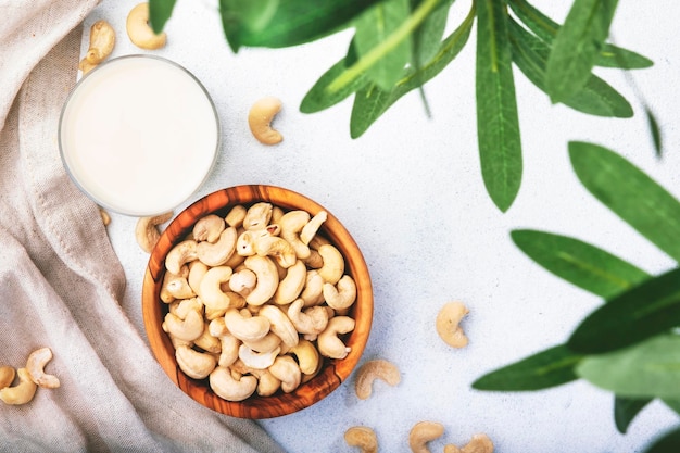 Vegan Cashew nut milk on white background Non dairy alternative vegan milk Healthy vegetarian food and drink Copy space top view