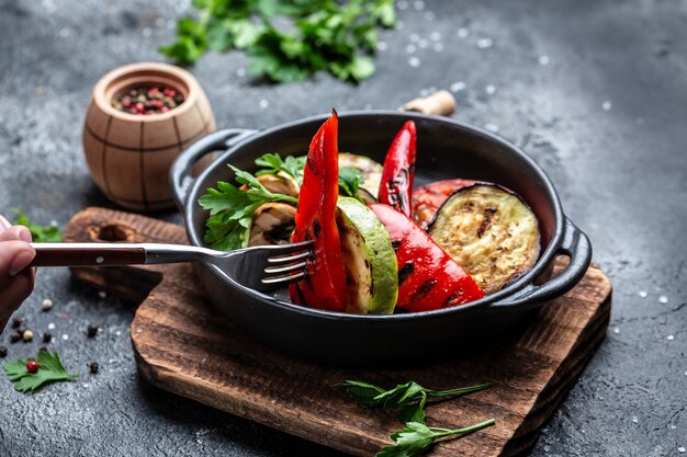 Vegan cuisine: Grilled mixed vegetables in a cast iron grilling pan, Detox and healthy superfoods bowl concept,