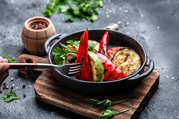 Vegan cuisine Grilled mixed vegetables in a cast iron grilling pan