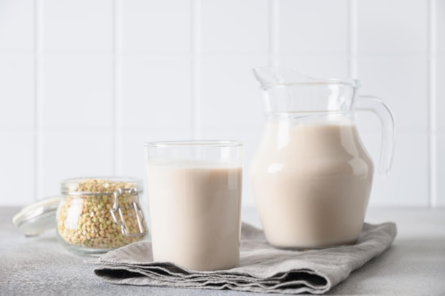 Vegan green buckwheat milk in glass plant based milk replacer