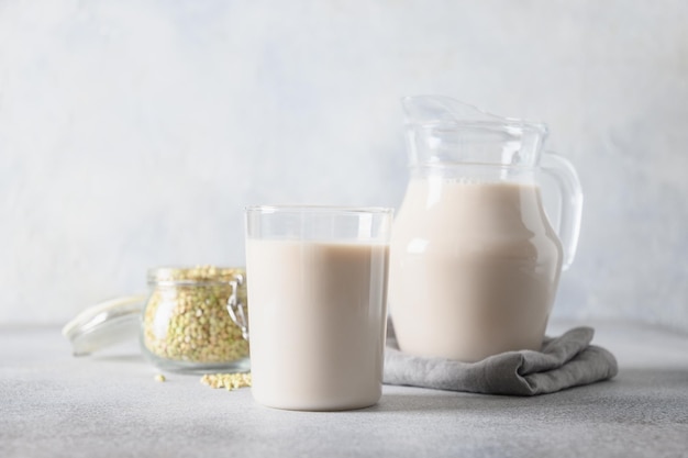 Vegan green buckwheat milk in glass plant based milk replacer