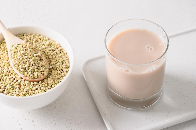 Vegan green buckwheat milk in glass plant based milk replacer