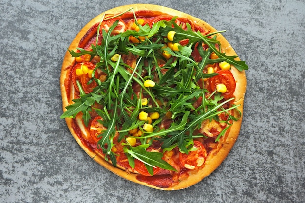 Vegan pizza with fresh arugula. Healthy food.