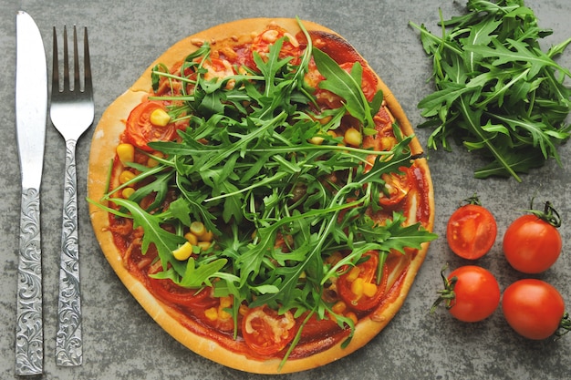 Vegan pizza with fresh arugula. Healthy food.