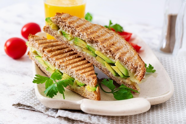 Vegan sandwich with cheese and avocado Vegetarian breakfast