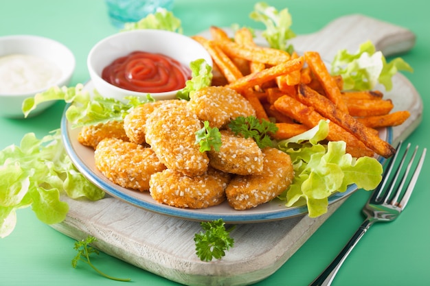 Vegan soy nuggets and sweet potato fries