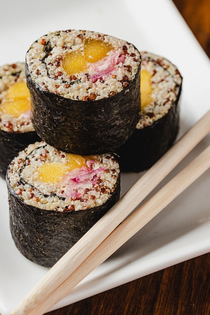 Vegan sushi rolls with quinoa, vegetables, and soy sauce