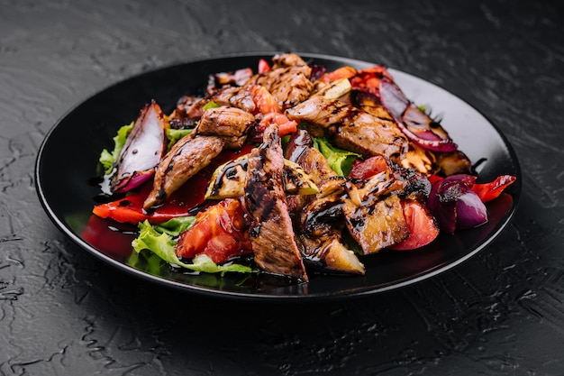 Vegetable and beef salad in a plate