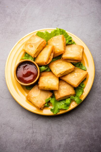 Vegetable Chinese samosa is a square shape a deep-fried snack prepared with homemade pastry sheets and tasty noodles stuffing