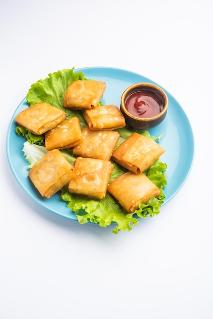 Vegetable Chinese samosa is a square shape a deep-fried snack prepared with homemade pastry sheets and tasty noodles stuffing